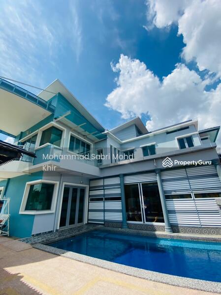 External view of villa with swimming pool.