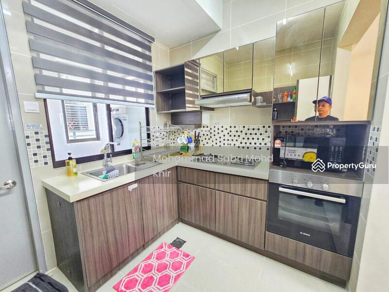 Kichen with built in cabinet, oven and fridge. 