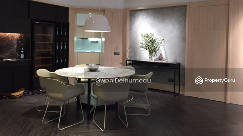 A dining room featuring a spacious wine fridge for your bottles collection