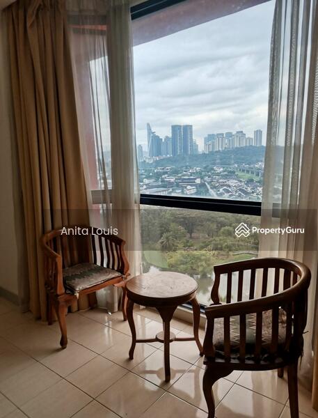 Coffee area beside ceiling-to-floor windows overlooking the lovely lake and city