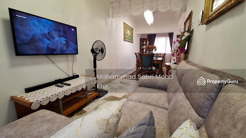 Ground floor room converted to TV area with sofa. 