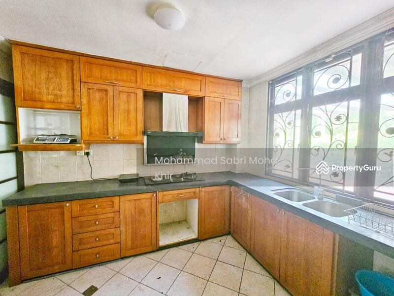 Ground floor kitchen with built in wood finishes cabinet. 
