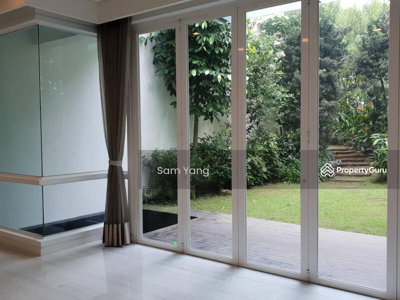 Twin Villa for Sale in Mont Kiara (Kuala Lumpur) - Sam Yang - Living room facing garden view with fish pond on the left hand corner. - PropertyGuru.com.my